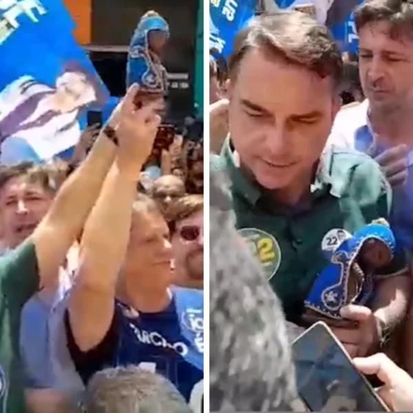 Flávio Bolsonaro segura imagem de Nossa Senhora em ato para rebater fake