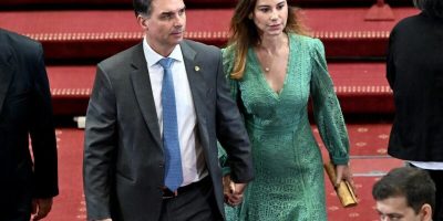 Brazil's senator Flavio Bolsonaro and his wife Fernanda Antunes Figueira arrive at the inauguration ceremony of Chile's new President Jose Antonio Kast at the National Congress in Valparaiso, Chile on March 11, 2026. Chile's most right-wing president in over three decades, Jose Antonio Kast, takes office on March 11, 2026, on a promise to tackle surging rates of violent crime and carry out mass migrant deportations. (Photo by RODRIGO ARANGUA / AFP)