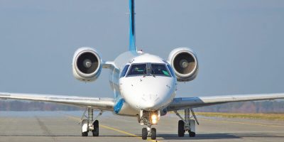 Borispol, Ukraine - October 23, 2011: Dniproavia Embraer ERJ-145 regional passenger plane is taxiing to the runway for takeoff